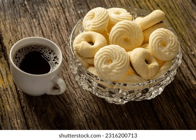 

Delicious mini butter flavored milk and (Sequilhos) guava cookies with a cup of coffee served in elegant jars on top of a rustic wood or white marble table, top view and selective focus - Shutterstock ID 2316200713