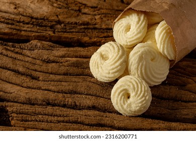

Delicious mini butter flavored milk and (Sequilhos) guava cookies with a cup of coffee served in elegant jars on top of a rustic wood or white marble table, top view and selective focus - Shutterstock ID 2316200771