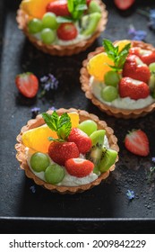 Delicious Mini Tart With Various Fruits. Sweet Summer Dessert. Tart With Cream And Fruit.