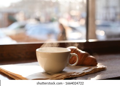 Delicious Morning Coffee, Newspaper And Croissant Near Window, Indoors