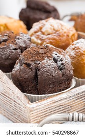 delicious muffins on a wooden tray, selective focus, vertical, closeup