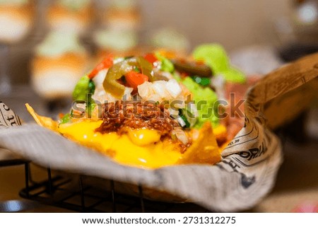 Delicious nachos serving pulled pork, melted cheese, and fresh pico de gallo