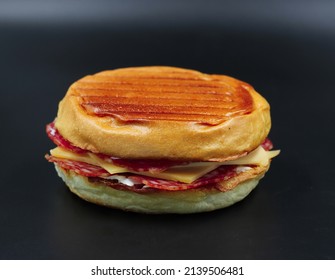 Delicious Natural Salami Sandwich With Pressed Cheese On Black Background