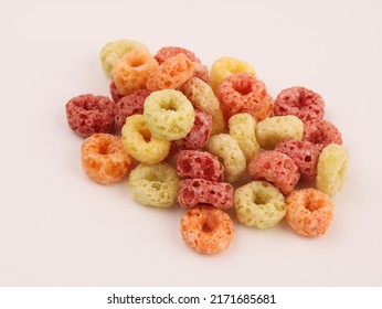 Delicious and nutritious fruit cereal loops flavorful on white background, healthy and funny addition to kids breakfast, cereal loops, fruity cereal, fruit cereal, meal