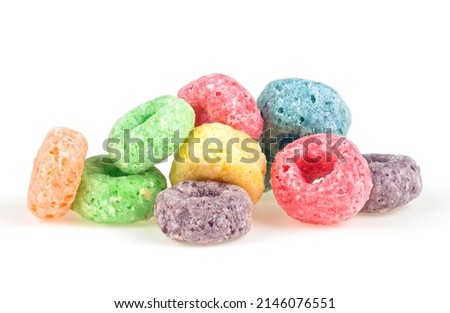 Delicious and nutritious fruit cereal loops isolated on a white background. Sweetened corn cereals. Healthy breakfast.