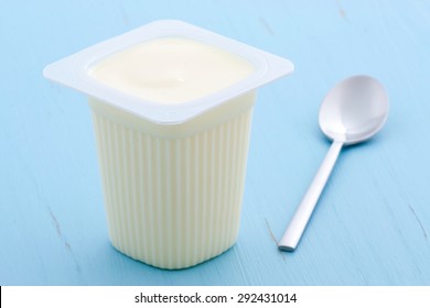 Delicious, Nutritious And Healthy Fresh Plain Yogurt Cup. On Vintage Retro Styling.