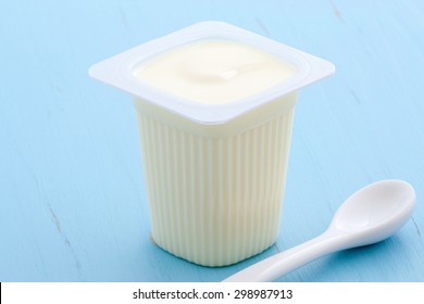 Delicious, Nutritious And Healthy Fresh Plain Yogurt Cup. On Vintage Retro Styling.