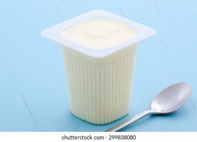 Delicious, Nutritious And Healthy Fresh Plain Yogurt Cup. On Vintage Retro Styling.