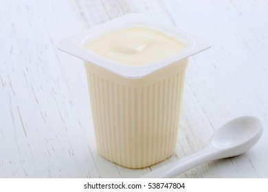 Delicious, Nutritious And Healthy Fresh Plain Yogurt Cup. On Vintage Retro Styling.