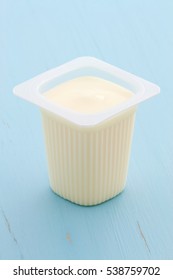 Delicious, Nutritious And Healthy Fresh Plain Yogurt Cup. On Vintage Retro Styling.