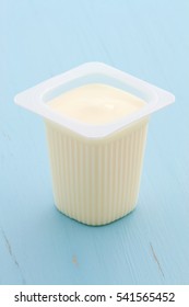 Delicious, Nutritious And Healthy Fresh Plain Yogurt Cup. On Vintage Retro Styling.