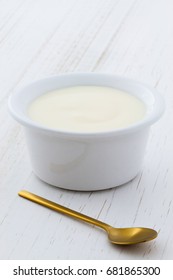 Delicious Nutritious And Healthy Fresh Plain Yogurt Cup. On Vintage Retro Styling.