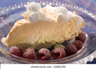 A delicious orange creamsicle pie with chilled raspberries.