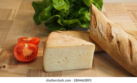 Delicious Organic Cream Milk Cheese, Salat And Home-made Bread And Tomatoes On Wooden Board