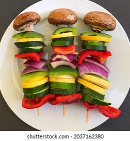 Delicious Organic Natural Vegetable Veggie Kabob Barbecue Grilling Mushroom Bell Pepper Cucumber Purple Onion Brown Red Yellow On White Serving Plate