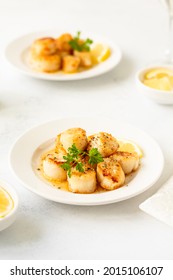 Delicious organic scallops with butter sauce and lemon. Restaurant menu