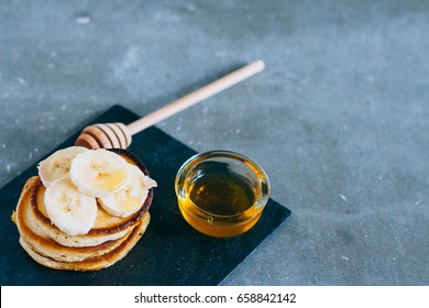 Delicious Pancakes With Banana And Honey On A Breakfast