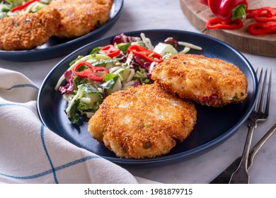 Delicious Panko Crumb Crusted Fish Cakes With Coleslaw And Red Pepper.