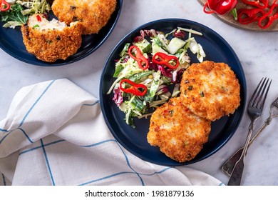 Delicious Panko Crusted Fish Cakes With Coleslaw And Red Pepper.