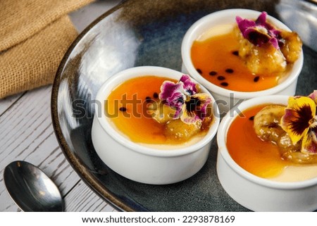 delicious passionfruit panna cotta with creamily banana dessert with spoon  