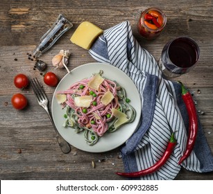 Delicious Pasta In Alfredo Sauce With Cheese, Glass Of Red Wine And Tomatoes, Topview