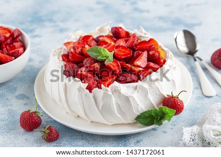 Delicious Pavlova cake with fresh strawberry, seective focus