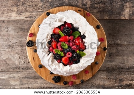 Delicious Pavlova cake with meringue topped and fresh berries