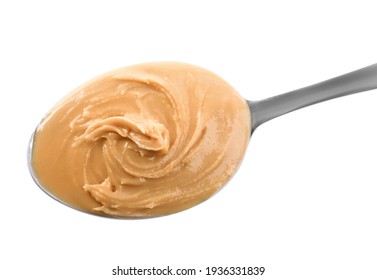 Delicious Peanut Butter In Spoon Isolated On White