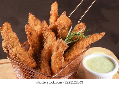 Delicious Pieces Of Fried Fish Breaded With Panko Flour Served With Herb Sauce, Cod.