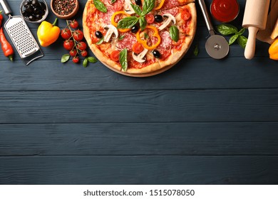 Delicious Pizza And Ingredients On Wooden Background, Copy Space