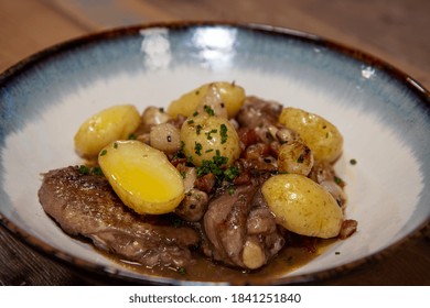 A Delicious Plate Of Chicken Coq Au Vin With Potatoes