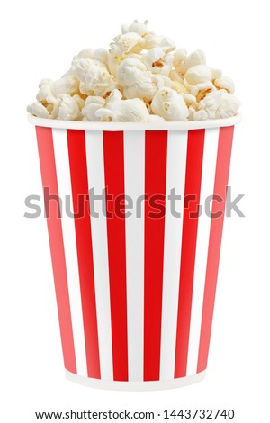 Delicious popcorn in a red striped paper cup, isolated on white background