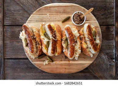 Delicious pork sausage hot dogs with sauerkraut and mustard