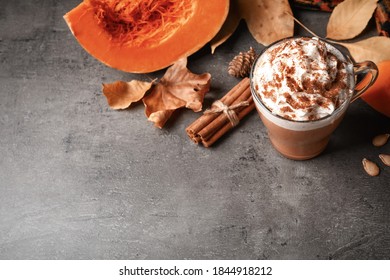 Delicious Pumpkin Latte And Ingredients On Grey Table, Above View. Space For Text