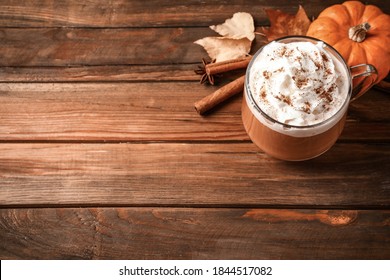 Delicious Pumpkin Latte On Wooden Table, Above View. Space For Text