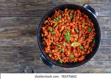 Delicious Ragu With Minced Meat, Vegetables And Tomatoes In Black Casserole - Ingredient For Pasta Bolognese Or Shepherd's Pie, View From Above