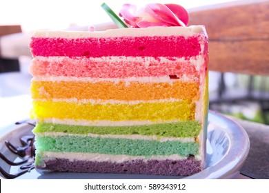 Delicious rainbow cake on plate