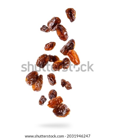 Delicious raisin in the air isolated on white background