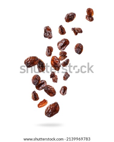 Delicious raisins in the air, isolated on a white background