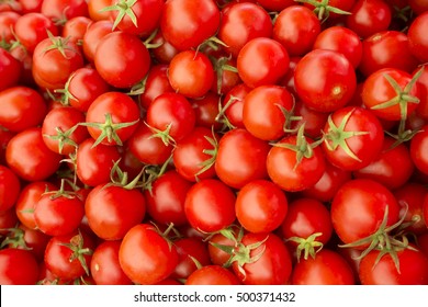 Delicious red tomatoes. Summer tray market agriculture farm full of organic vegetables It can be used as background. (selective focus)