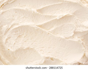Delicious refreshing creamy Italian lemon or vanilla ice-cream for a summer dessert or takeaway, close up full frame background texture