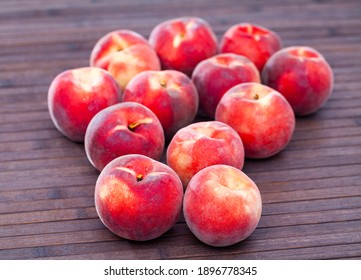 Delicious ripe peaches fruit on wooden surface close up