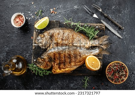delicious roasted dorado or sea bream fish with lemon. organic healthy products. Detox and clean diet concept. place for text, top view.