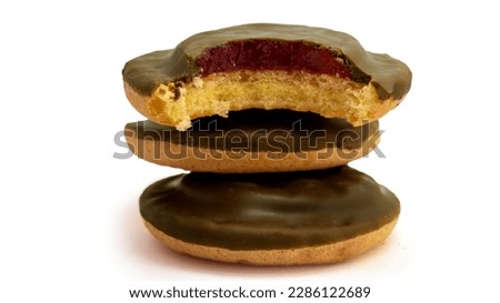 Delicious round chocolate Jaffa cakes, biscuit, cookies whole and bited isolated on white background high quality details