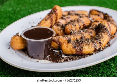 A Delicious Russian Donut, Churros With Chocolate And Oreo