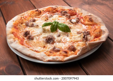 Delicious Rustic Italian Pizza With Pork Sausage, Tomato Sauce, Pecorino Romano And Onion 