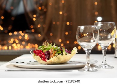 delicious salad and two spare glasses