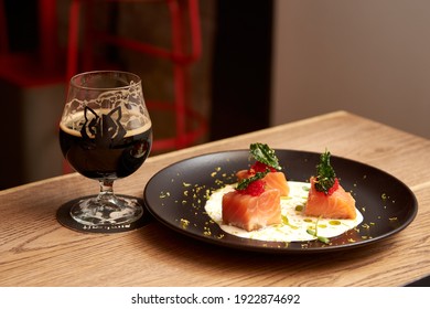 Delicious Salmon In Restaurant On A Wooden Table. Tasty Seafood With Beer In Cafe Or Pub Menu.