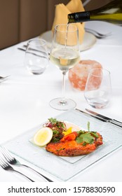 Delicious Salmon Tikka Starter With A Glass Of White Wine