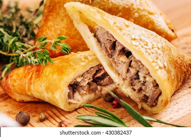 Delicious samosa pies with meat on plate. Menu, restaurant, recipe concept. Served in traditional oriental restaurant. Selected focus.